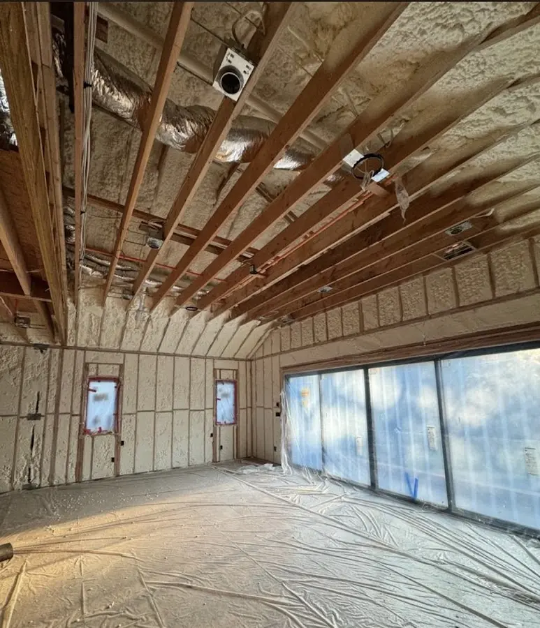 Interior walls and ceiling insulated with spray foam during new construction in Atlanta